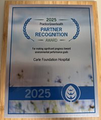 2025 Partner Recognition plaque resting on table.