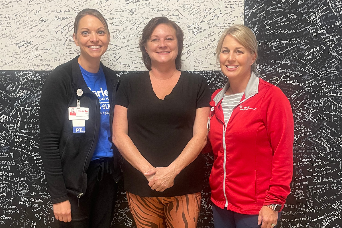 Carle Richland Therapy Services employees with patient.