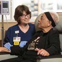 Nurse talking to an elderly lady 